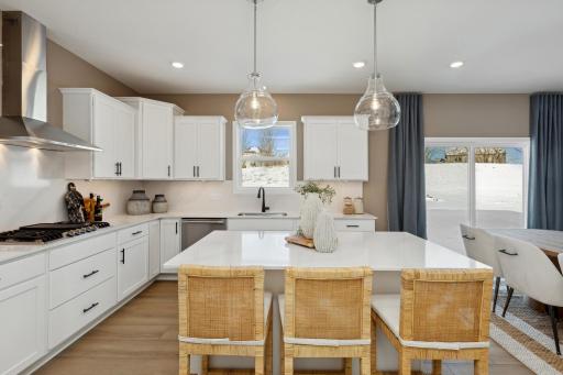 (Photo of actual model) Ample cabinetry storage, a stainless steel sink and under-cabinet task lighting are all included.