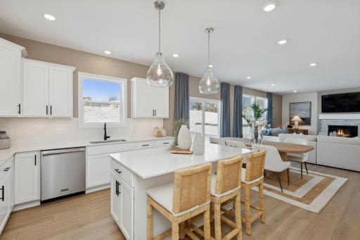 (Photo of actual model) There is plenty of seating at the kitchen island and dining area.