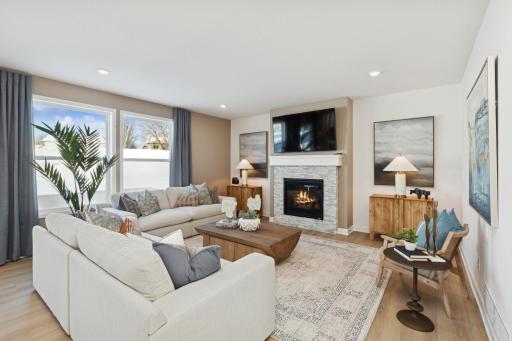 (Photo of actual model) Rest and relax in the Great Room, which features a fireplace for cozy nights.