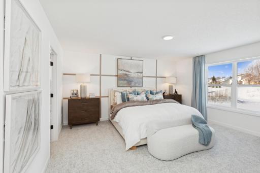 (Photo of actual model) The primary suite is found on the second floor, complete with a cozy bedroom, an en-suite bathroom and a walk-in closet.