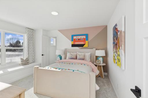 (Photo of actual model) Three secondary bedrooms can be found upstairs, just down the hall from the owner’s suite.