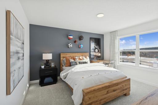 (Photo of actual model) Three secondary bedrooms can be found upstairs, just down the hall from the owner’s suite.