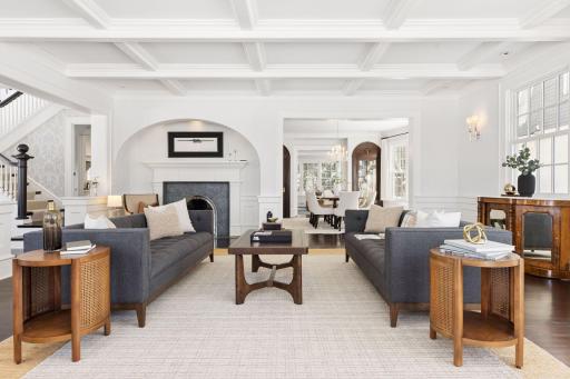 Gorgeous formal living room with original fireplace alcove and views of the lake and private back yard.