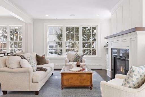 Family room with gas fireplace, TV above fireplace and views of the private back yard