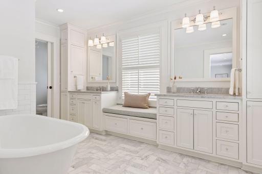 Primary bath with ample sized soaking tub, dual vanity, in-heat floors