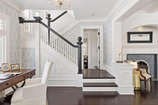 Staircase opens to the chef's kitchen