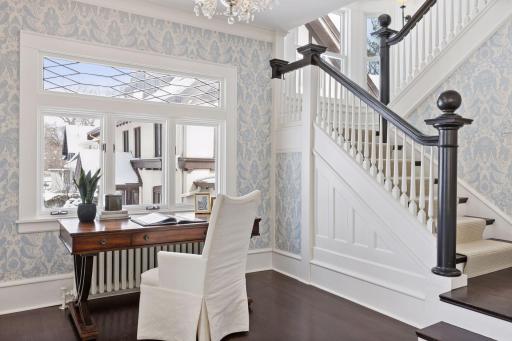 Sitting room off of the formal living room with stunning original staircase