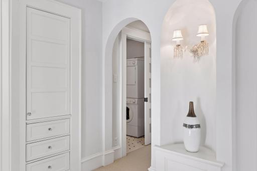 Built in linen closet and upper level laundry room
