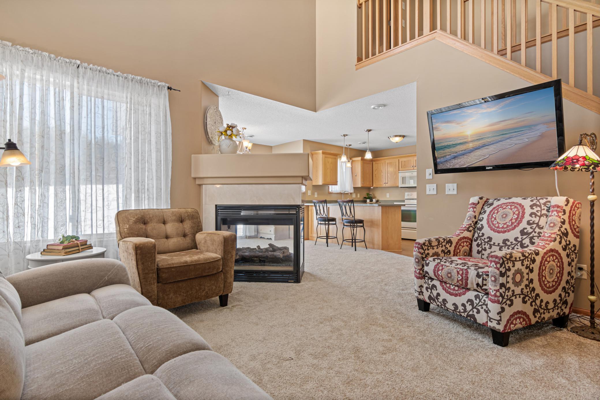 Immediately you are greeted by a two-story living room