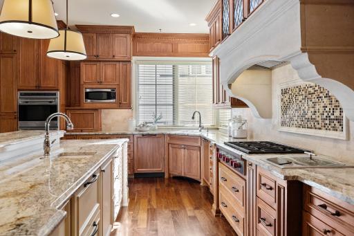 Wolf cooktop, double wall oven, hidden appliance cabinet, 2 sinks & 2 dishwashers, ice maker!