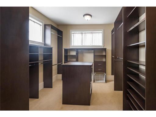 Fantastic primary closet with access from the bathroom and to the hallway