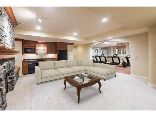 Walk up bar with sink, dishwasher, microwave and fridge.