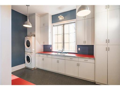 "Bike room" has access to the outdoors and a stackable washer/dryer