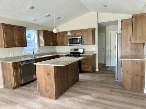 Upgraded appliances included, beautiful natural wood custom cabinetry.