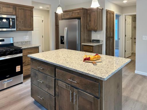 Large center island with granite countertop