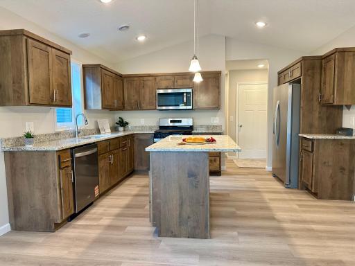Kitchen with beautiful custom cabinets and granite counters.jpeg