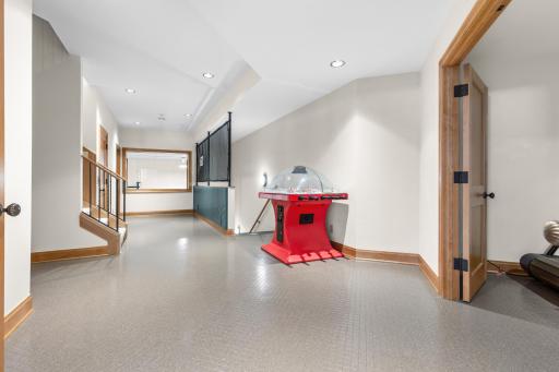 Game room with viewing to the sport court