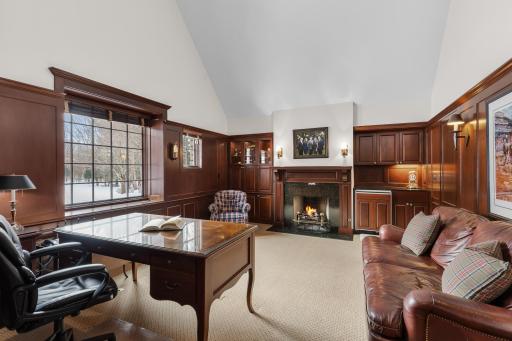 Custom millwork and fireplace in office/library