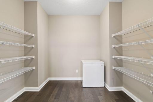 Adjacent to the Kitchen is a spacious walk-in pantry for all your Costco finds!