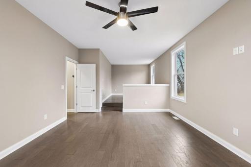 The main level Home Office is a private space where working from home is a breeze. The space features a separate sitting area making this a great den or space to get away.