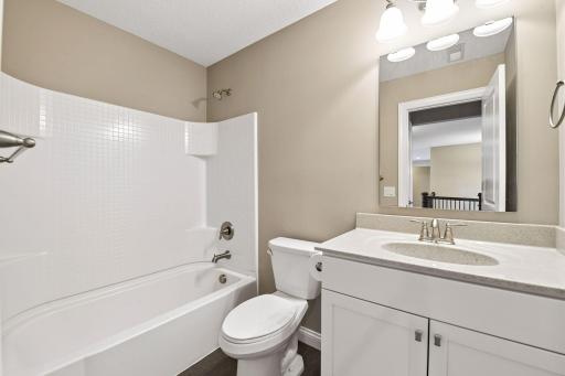 A full bathroom is adjacent to one of the bedrooms.