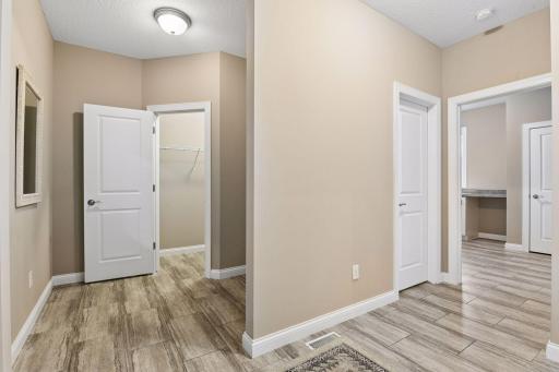 A spacious Mud Room features a walk-in closet and separate pantry closet.