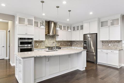 The Chef's Kitchen is sure to please with enameled cabinetry featuring soft close doors and drawers and roll-out shelving.