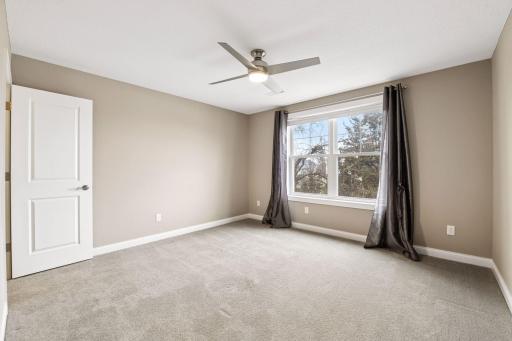 There are three additional bedrooms located on the upper level.