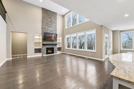 The open floor plan features a two-story Great Room with a gas fireplace and hardwood floors.