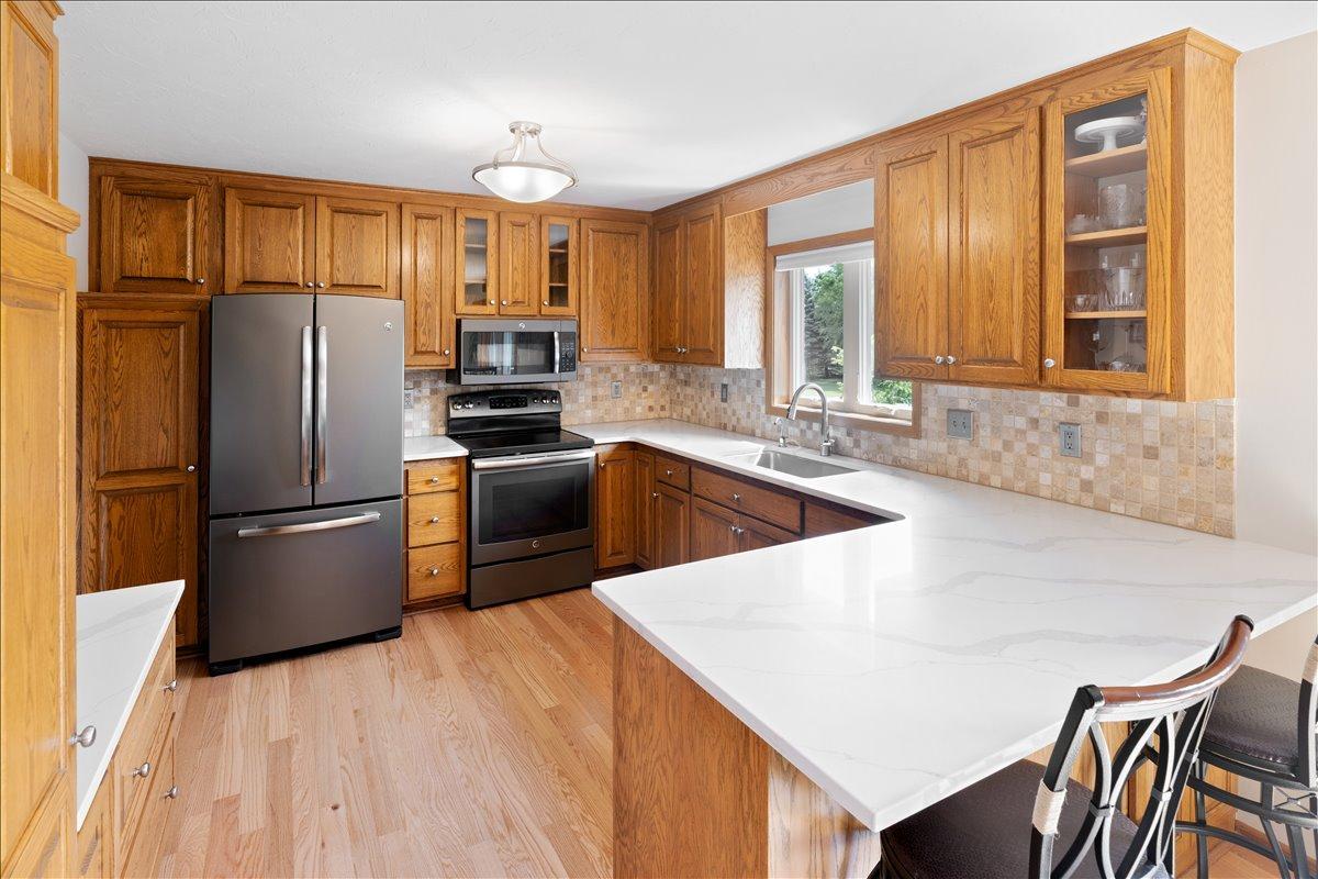 Engineered Hardwood - kitchen/dining/hall/stairs - 2024