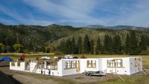 Professional Photo ICF Foundation - Concrete is poured into the forms which have metal bars for stabilization and insulation made of recycled denim which repels water and pests.