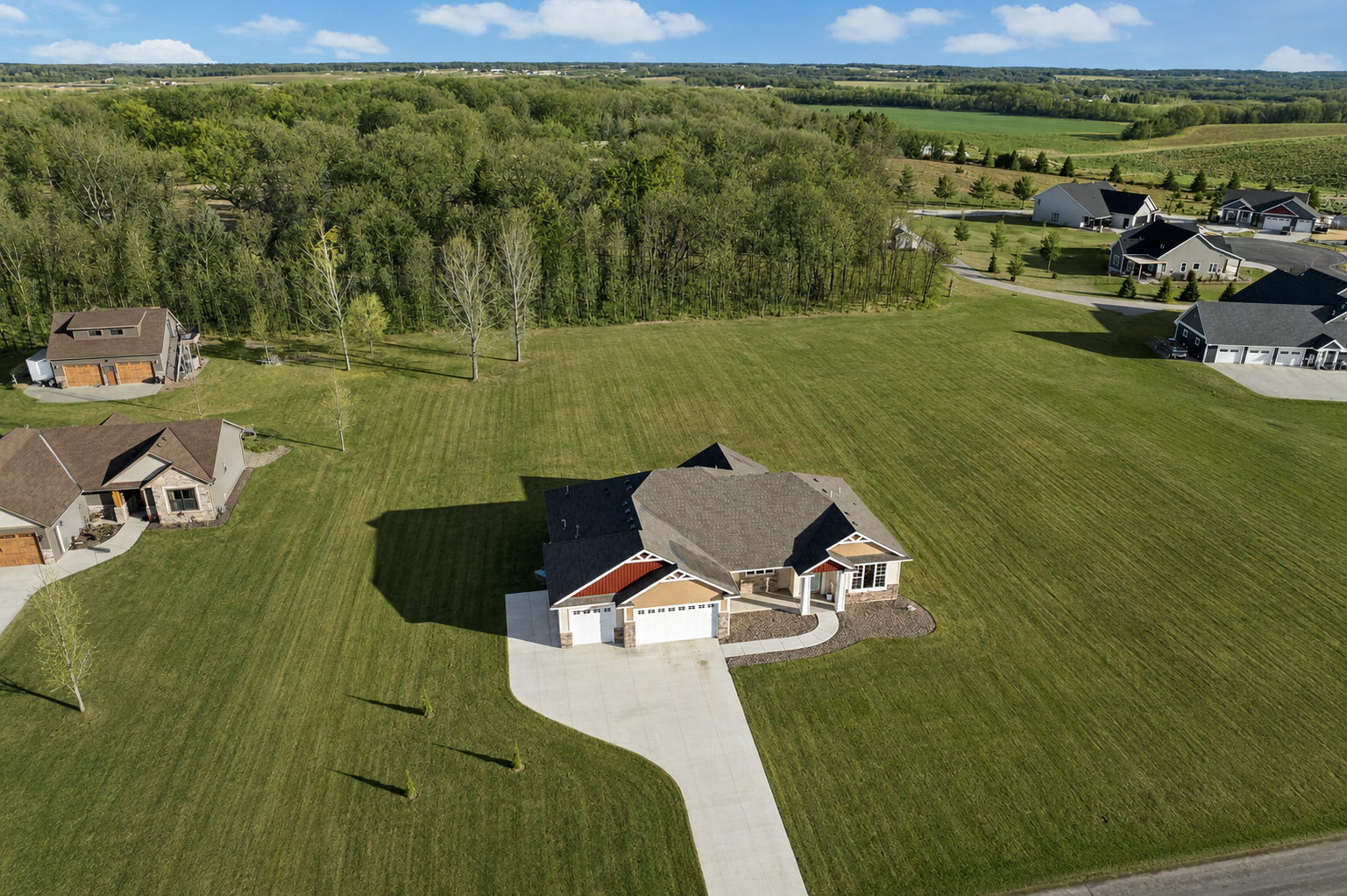 With so much room to roam, this tree lined lot is just over an acre. Photo has been virtually adjusted to show green grass and trees.