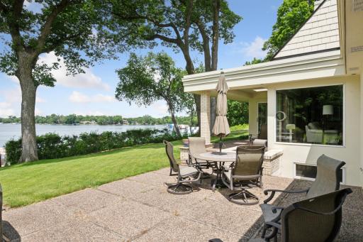 The property features a generous lakeside yard with beautiful, elevated views