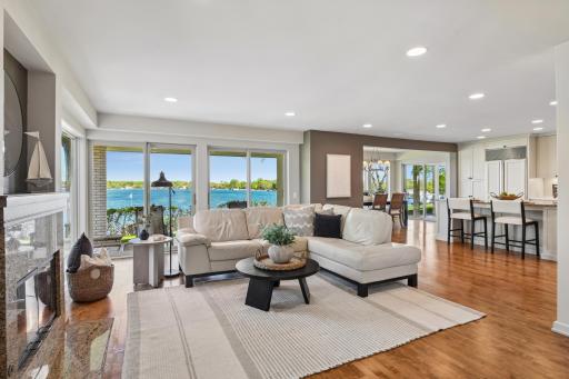 An inviting open floor plan with walls of windows provides stunning lake views.