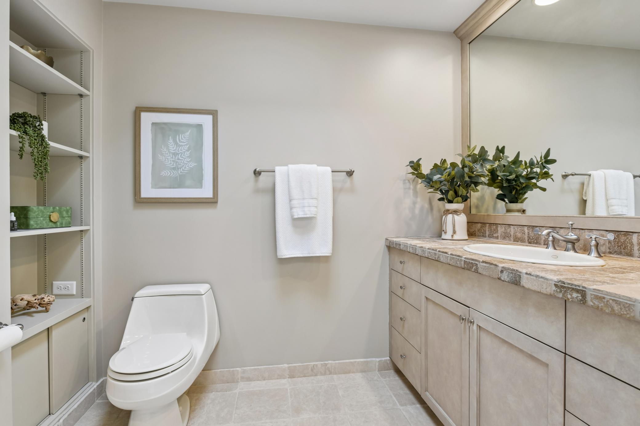 Custom designed primary bath offers two separate powder rooms with a shared shower and tub area.