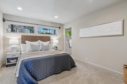The secondary bedroom ensuite on the main level is perfect for guests with a generous sized wall closet and private 3/4 bath.