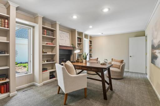 Nicely appointed, main level office features built-in bookshelves and a cozy gas fireplace. This room has also been used as a formal dining room if one would prefer.