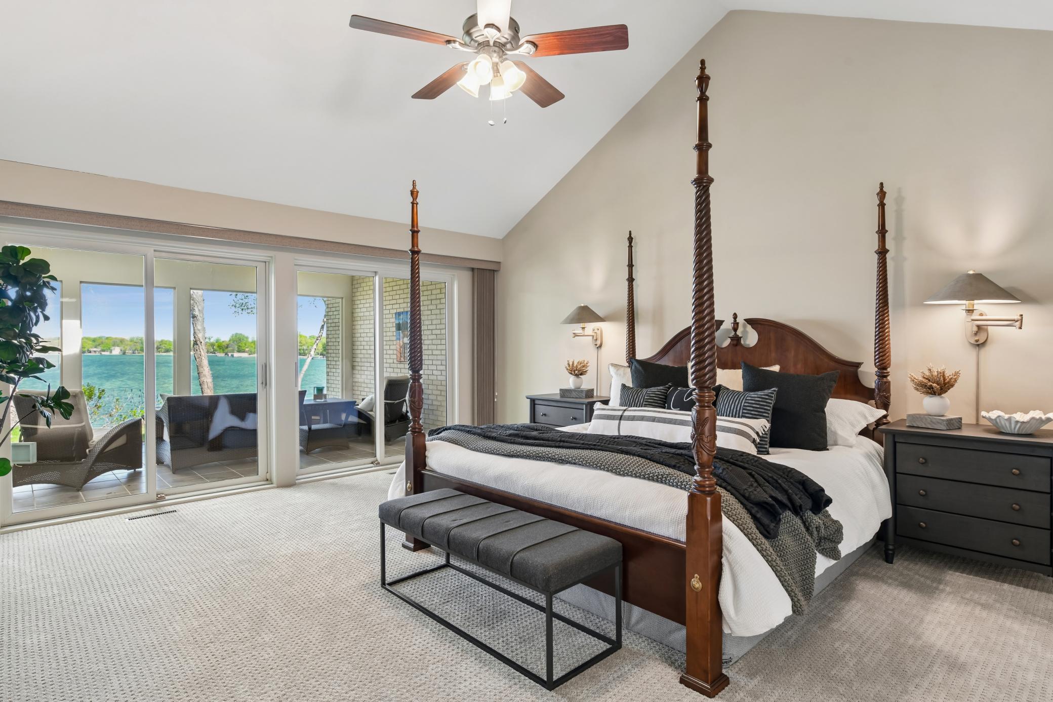 Wake up every morning to serene lake views. The primary bedroom is spacious with a vaulted ceiling.