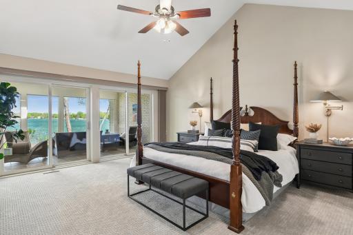 Wake up every morning to serene lake views. The primary bedroom is spacious with a vaulted ceiling.