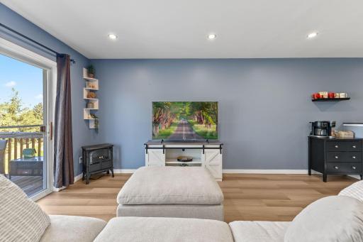 The living area is spacious, and flows to a HUGE deck.