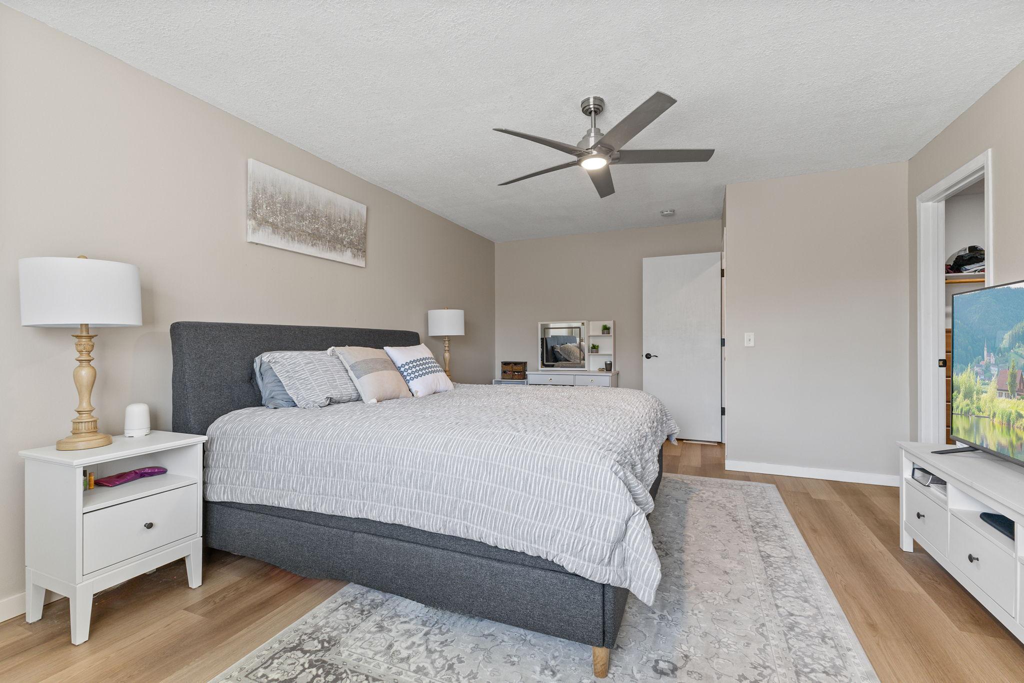 Another view of the primary bedroom, with the closet located to the right.