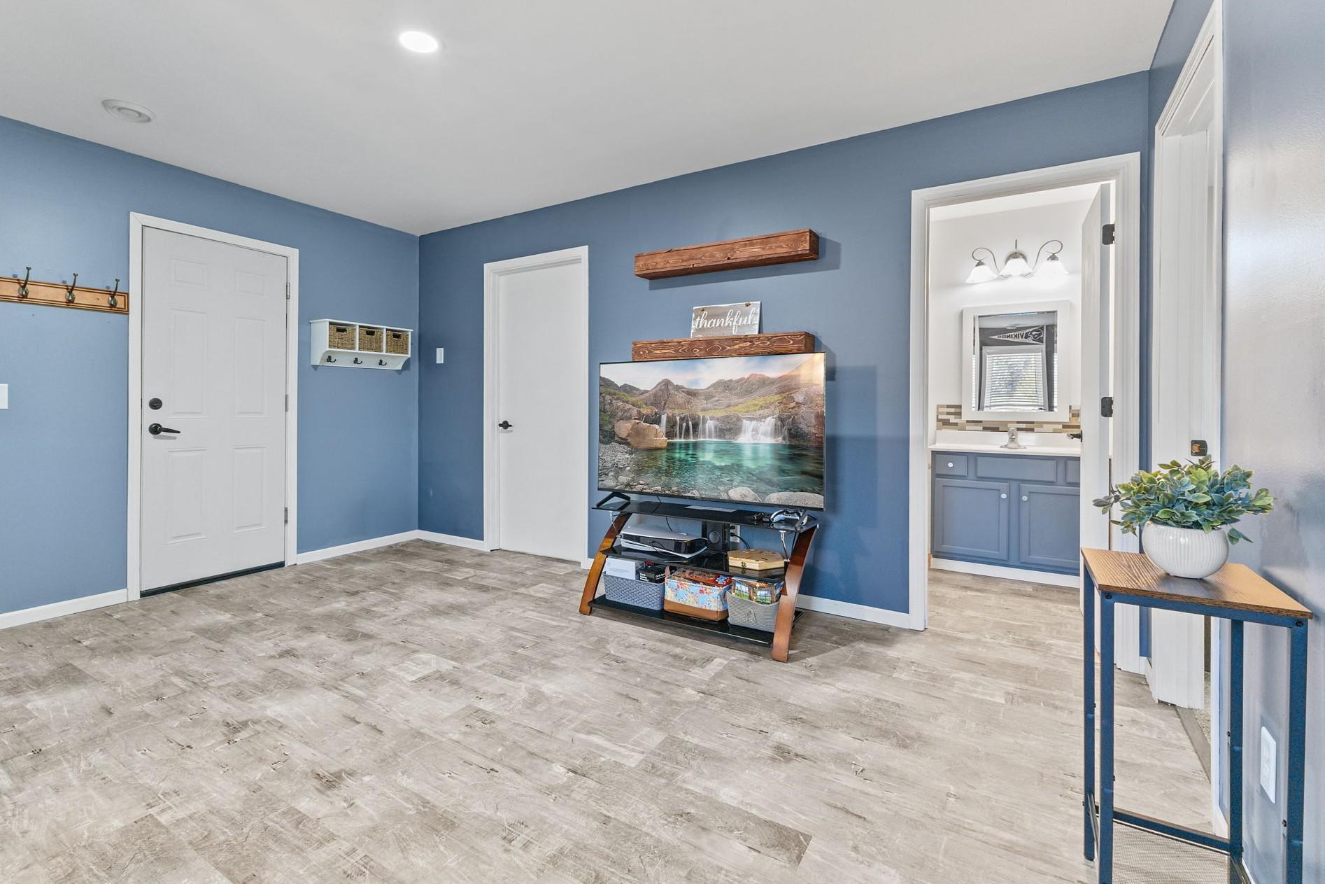 Downstairs, note the modern-looking life-friendly newer flooring that extends into the full bathroom as well.