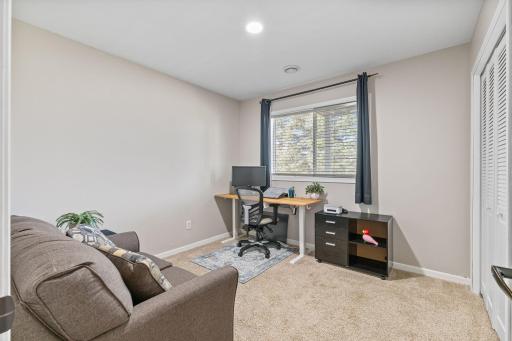 The third bedroom, currently used as a office space/lounge