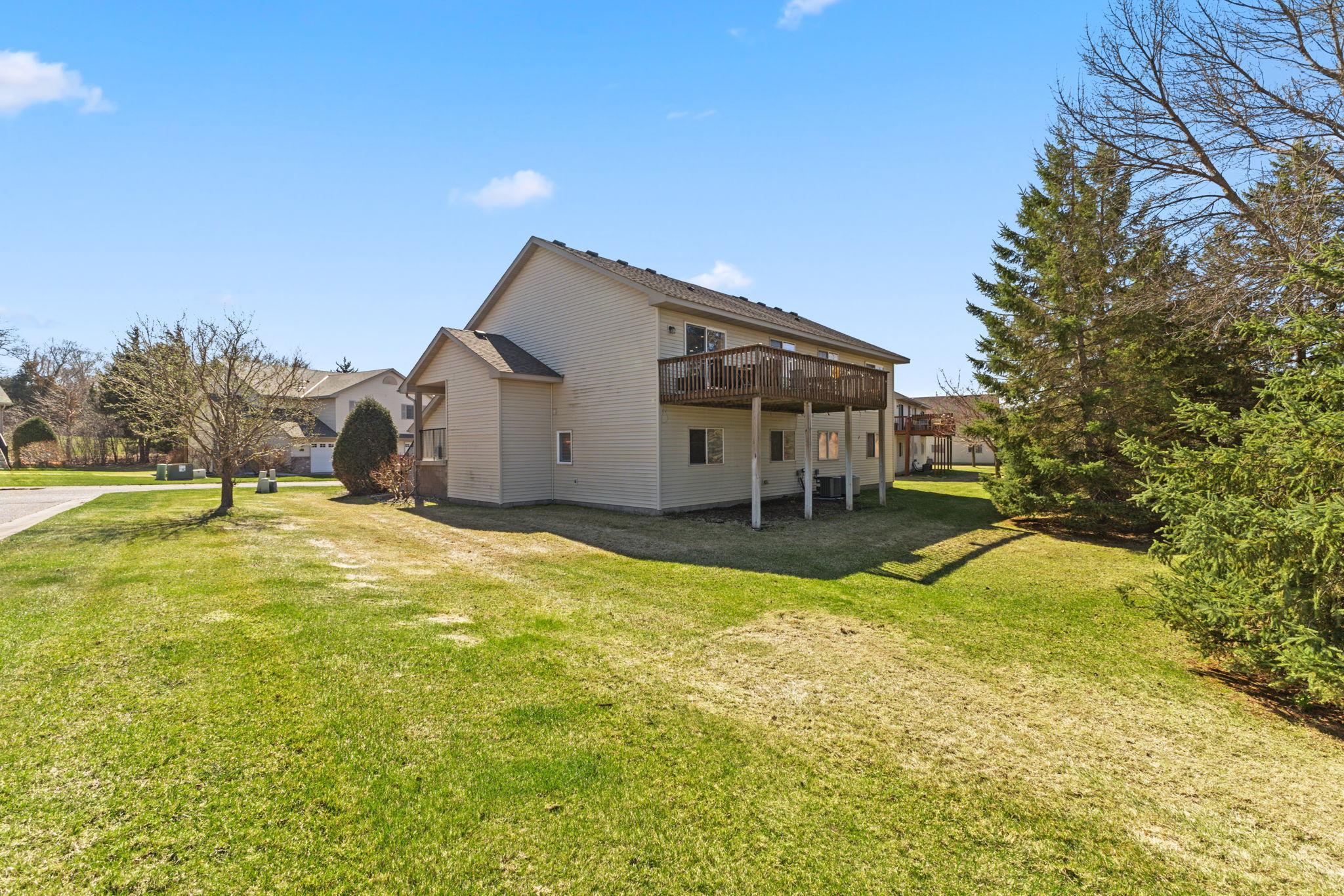 Another view of the home's expansive deck and greenspace beside and behind the unit. The units are thoughtfully spaced to provide for privacy and views.