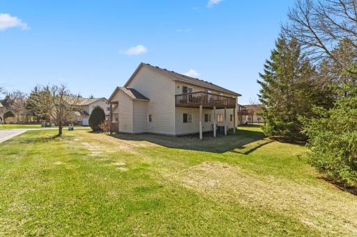 Another view of the home's expansive deck and greenspace beside and behind the unit. The units are thoughtfully spaced to provide for privacy and views.