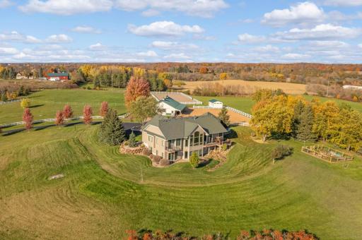 Home is perfectly positioned on 9 acre lot with sweeping views of rolling countryside all high & dry!