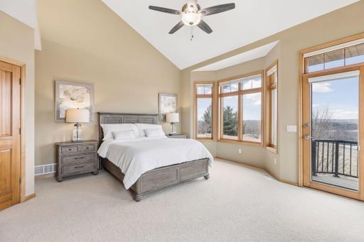 Primary bedroom is a retreat in itself! Bay window and a balcony overlooking the large backyard and rolling countryside is a peaceful start and end to the day.