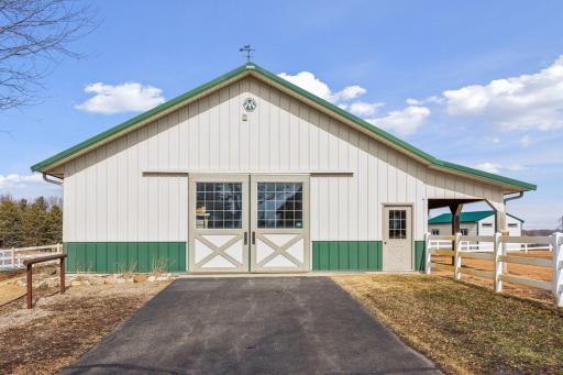 36x48 Morton Barn with Dutch Doors is heated & sure to impress! Three large box stalls & rubber mats, high power fans, tack room, 1/2 bath and 10' doors for easy access. Ethernet Wi/Fi/Nest cameras for 24/7 monitoring. for horses.