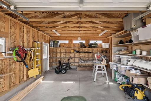 Storage shed is 16x24 with concrete floor, overhead door, service door and power.