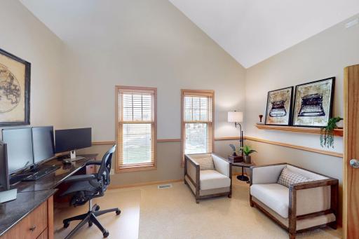 Main level bedroom 2 currently used as office features vaulted ceiling, french doors and closet.